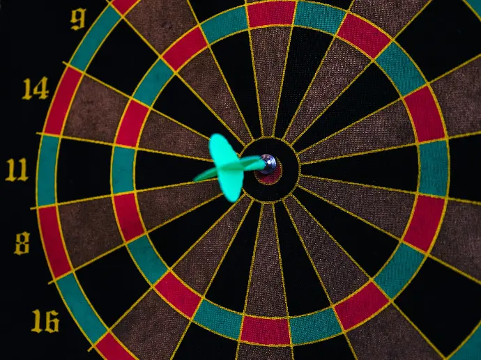 a dart board with darts